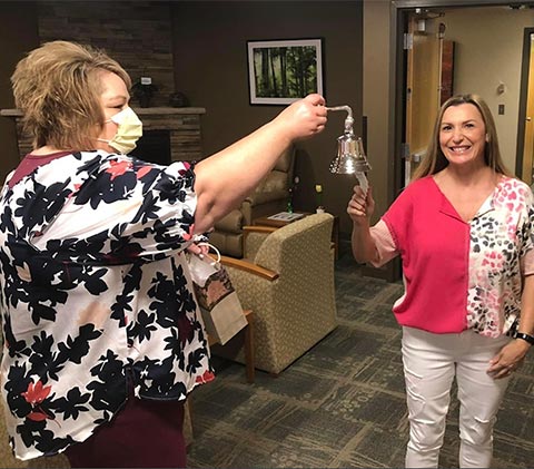 Lisa ringing the cancer free bell