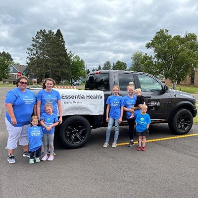 volunteers standing next to truck