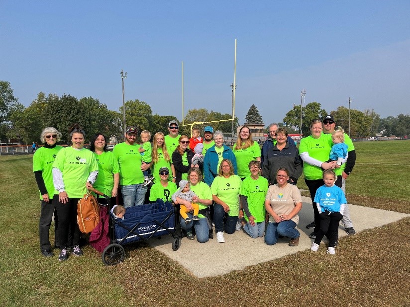 volunteers in front of bins