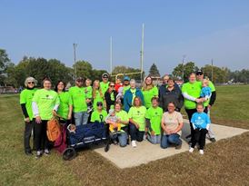 volunteers in front of bins