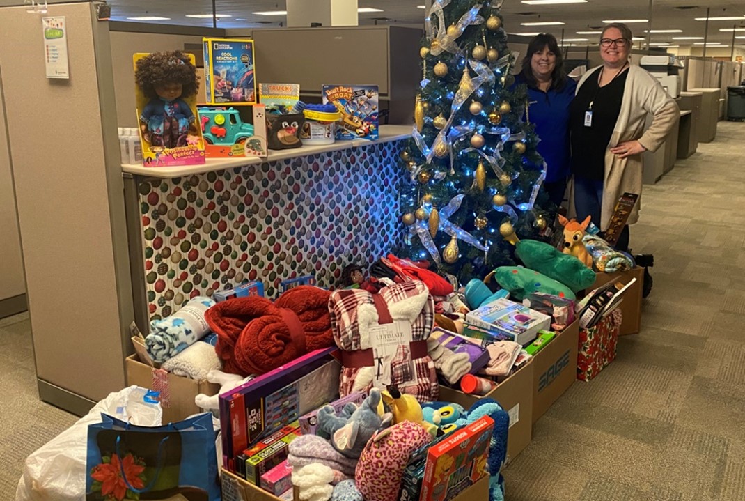 Essentia Employees standing with collected donated items