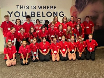 Group In Red Tee Shirts.