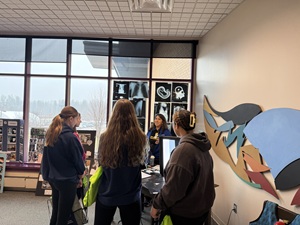 Essentia employees introducing 10th graders  to hands-on learning activities